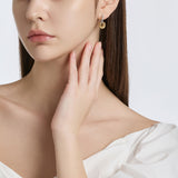 Selection. D Brass Earring